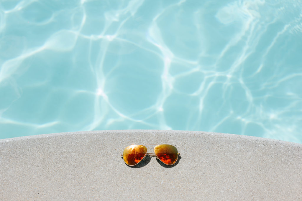 Sun glasses by pool