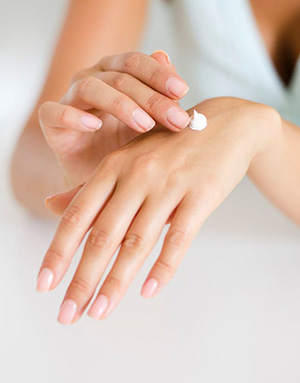 Hand cream on back of women's hand