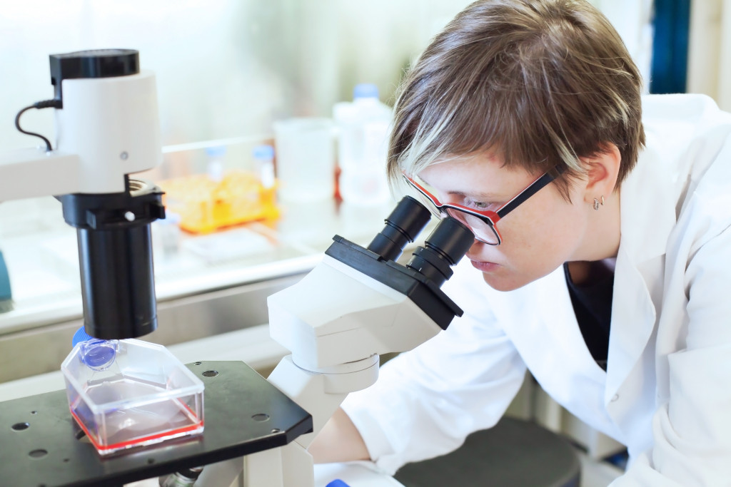 Women looking through Microscope