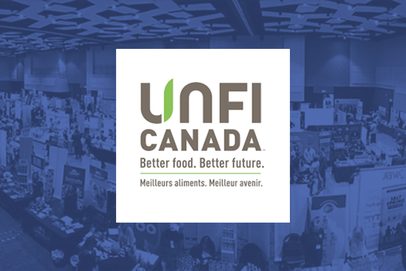 UNFI Canada logo on an image of the conference floor