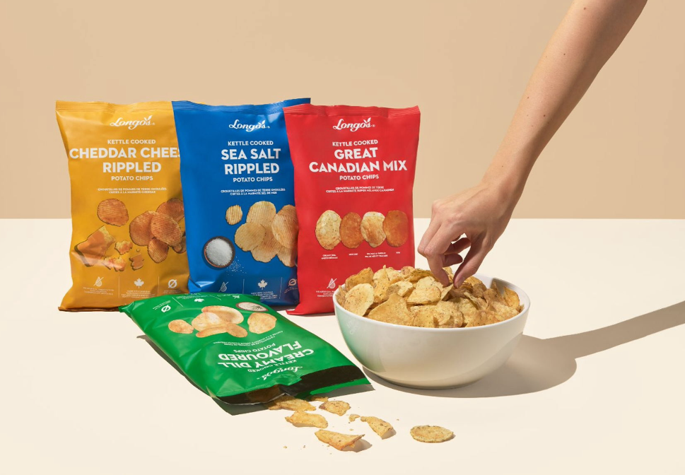 Various varieties of Longos potato chips set around a bowl of tasty product.