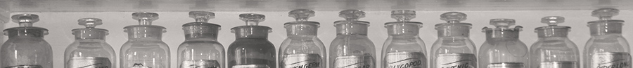 line-up of old jars on a shelf