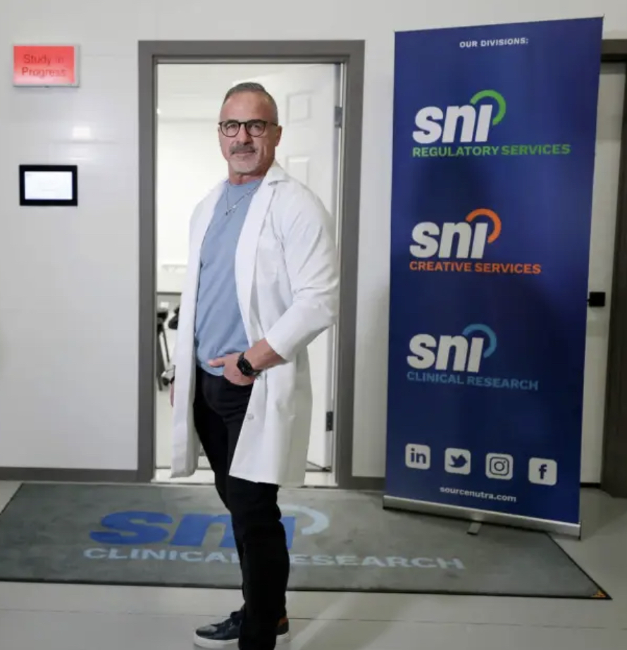 Bernie Desgagnes, President and CEO of SNI, in lab coat in SNI's Clinical Trial Facility 