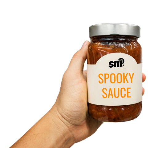 person holding up a jar called "SPOOKY SAUCE" with a halloween-style SNI logo