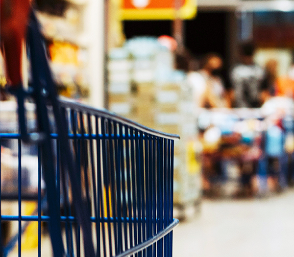 Photograph of a grocery cart in a grocery store